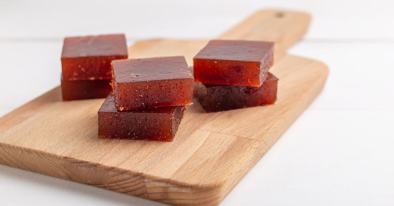 Homemade gummies on a cutting board.