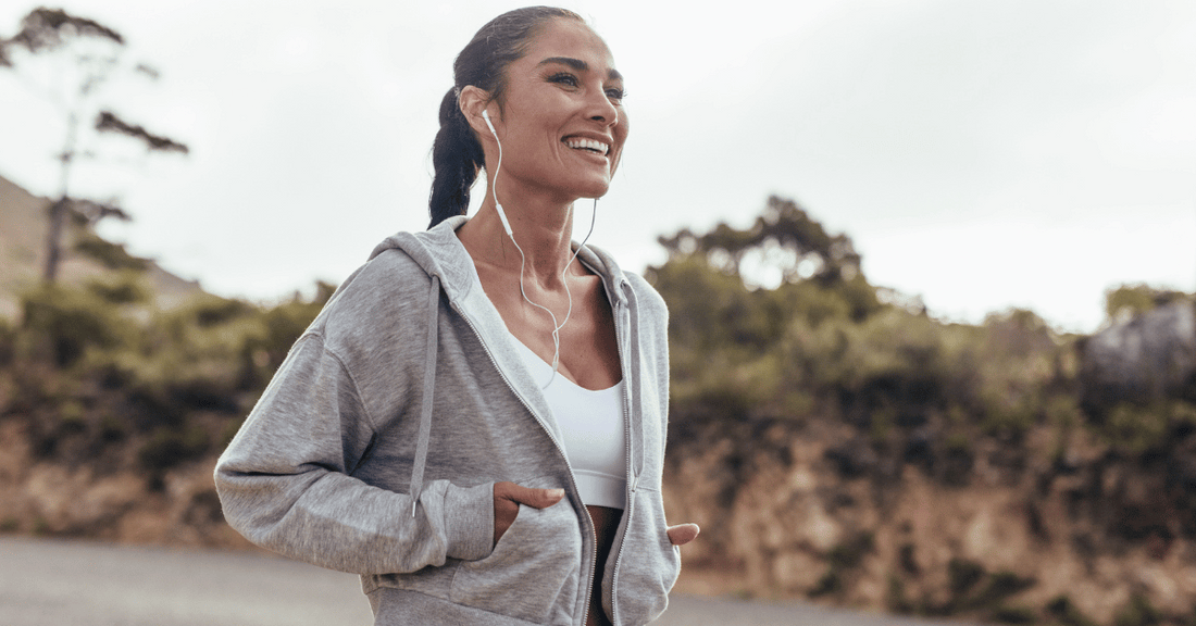 A woman goes walking outdoors.