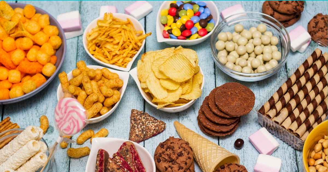 A variety of favorite kids' snacks (ultra-processed foods) on a table.