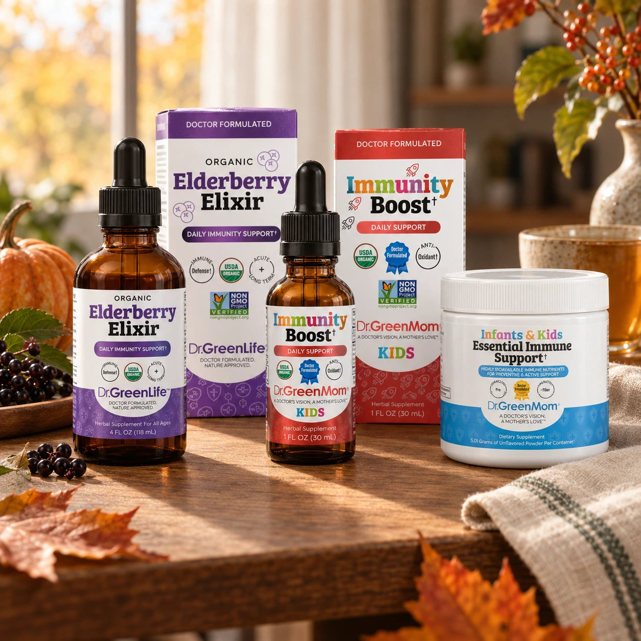 Elderberry Elixir, Immunity Boost Kids, and Essential Immune Support on an autumn table with tea and pumpkins